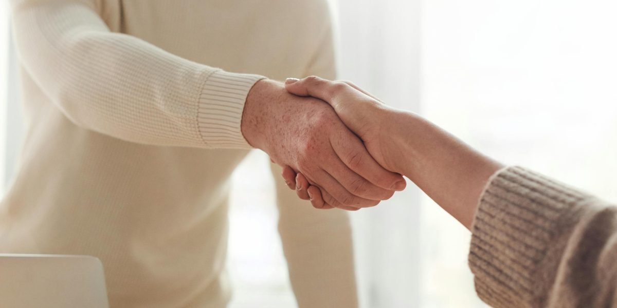 Professionals shaking hands, symbolizing a successful mortgage pre-approval and property deal.