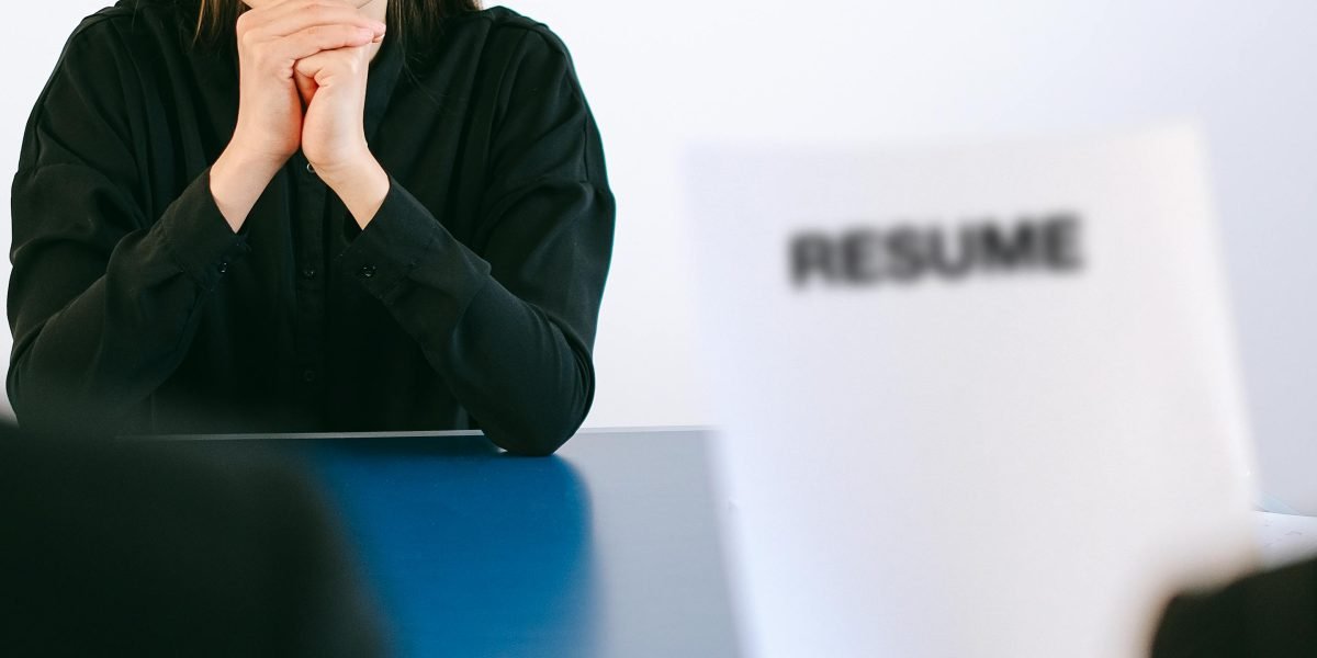 A person confidently interviewing a real estate expert to assess their qualifications and specialization.