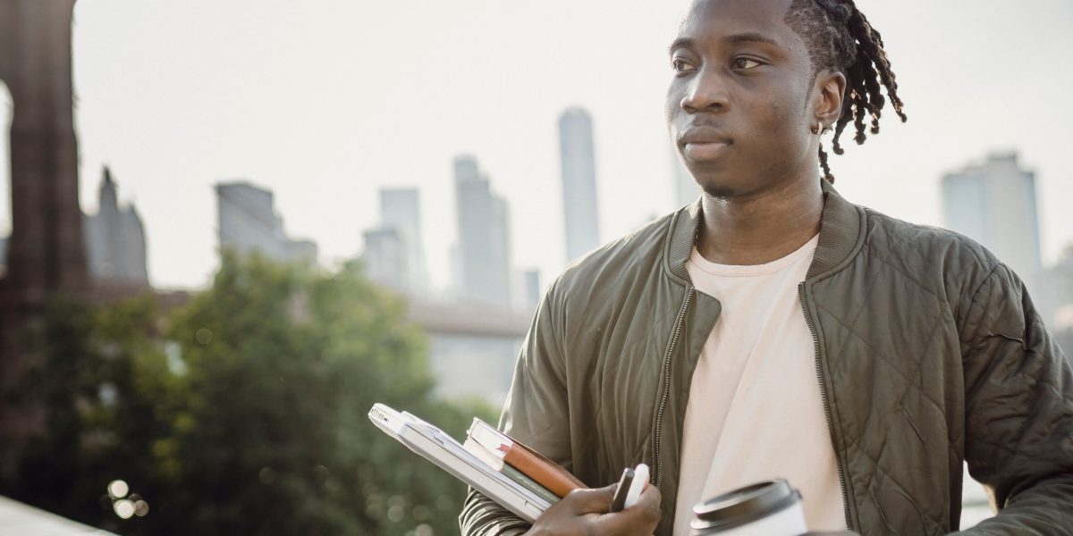 Imagine the future: A person gazes at a modern city skyline, envisioning investment opportunities.