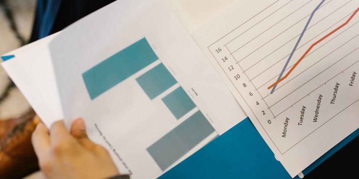 Professionals analyzing financial metrics and market trends to assess property investment potential.