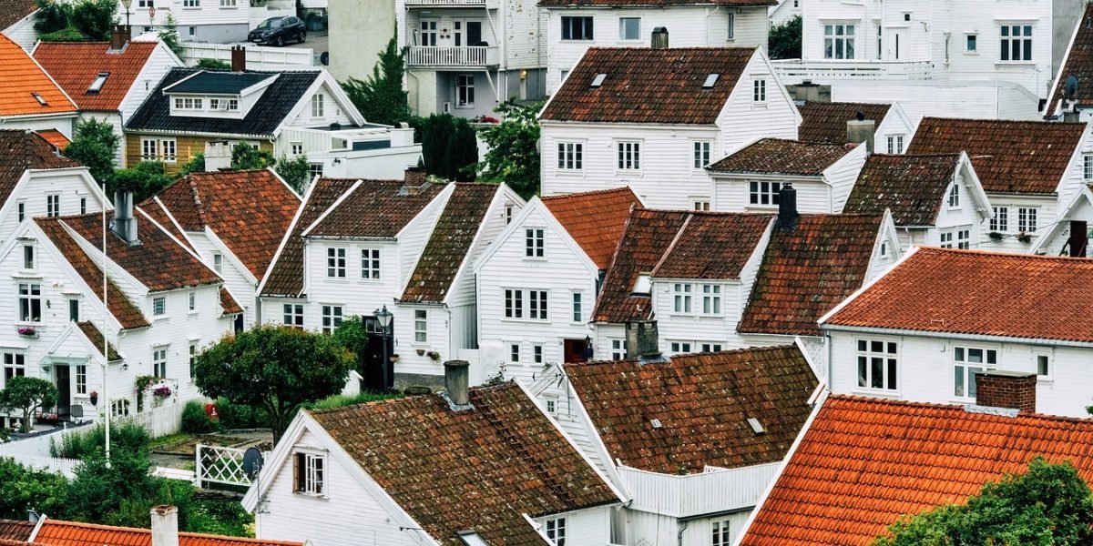 A potential buyer thoughtfully considering various luxury property options.
