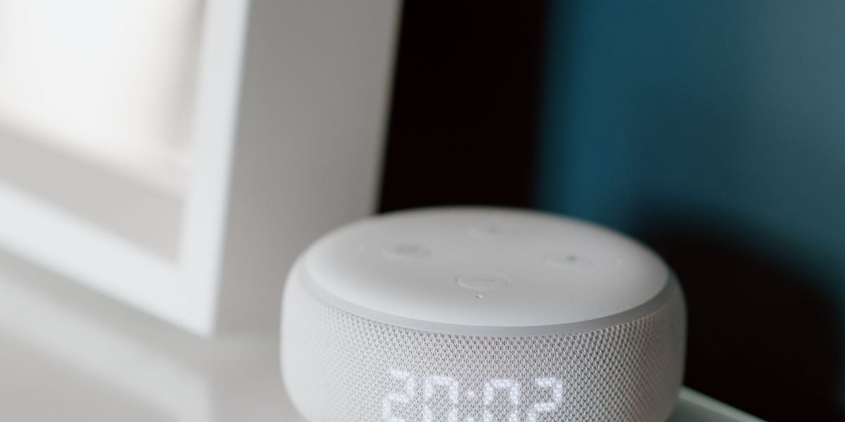 A person effortlessly managing home functions using voice commands, highlighting Smart Cube's advanced automation.