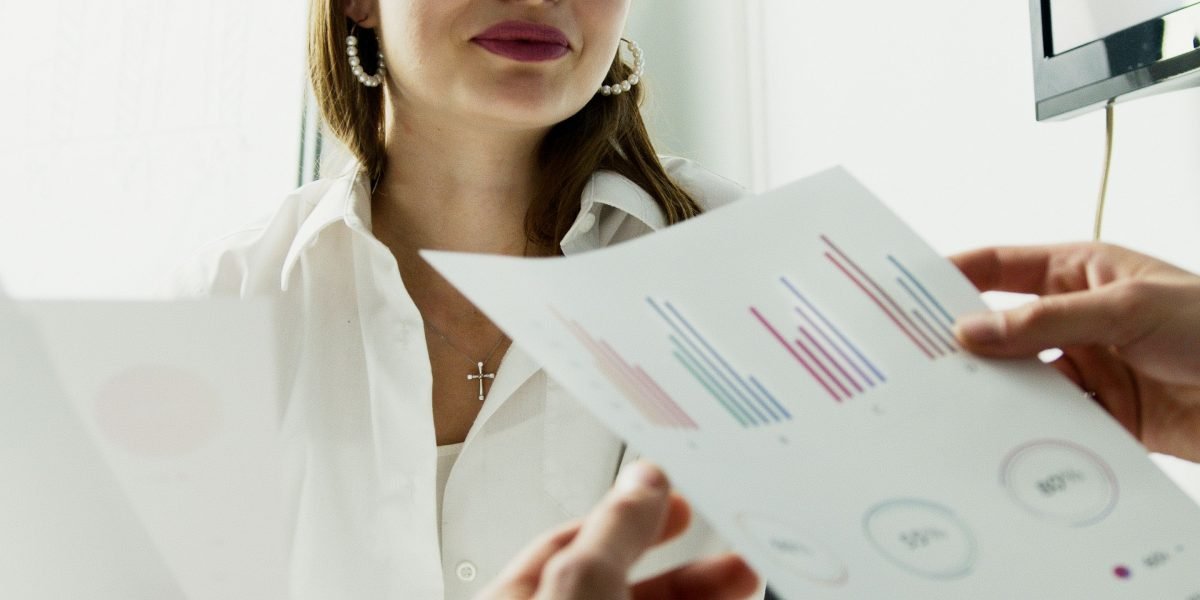 An investor reviewing financial projections and data, reflecting confidence in the promising real estate market.