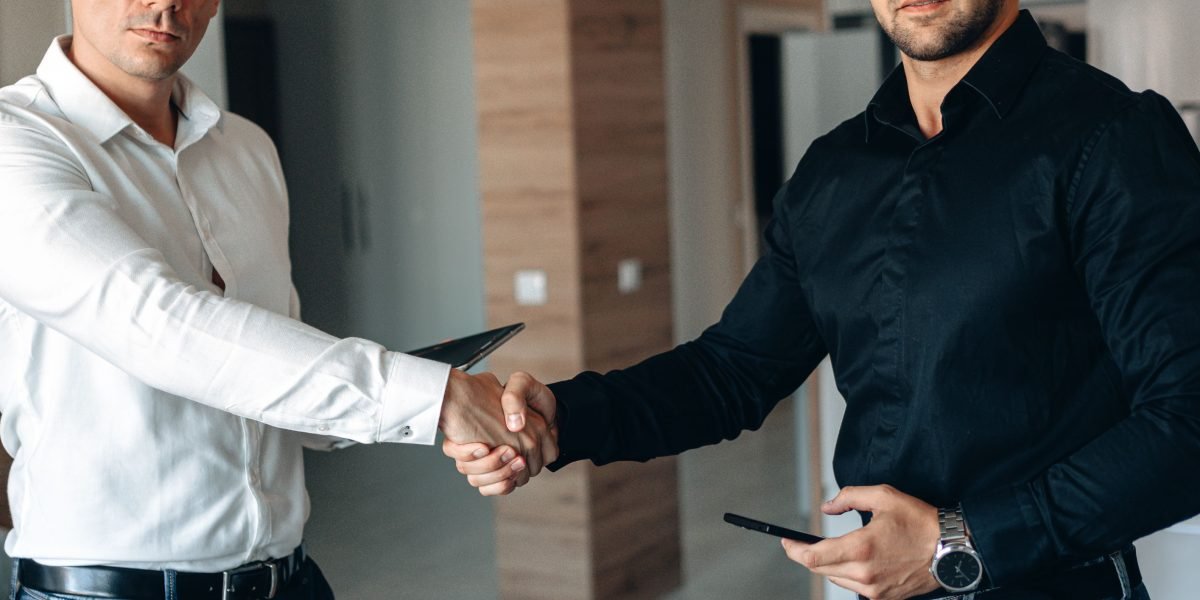 Forming a new partnership, symbolizing trust and the start of a seamless property buying journey with a real estate agent.
