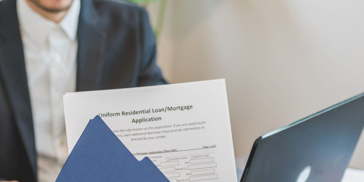 An investor engaged in a detailed discussion with a real estate advisor, emphasizing the importance of expert guidance for successful property investments in Dubai.