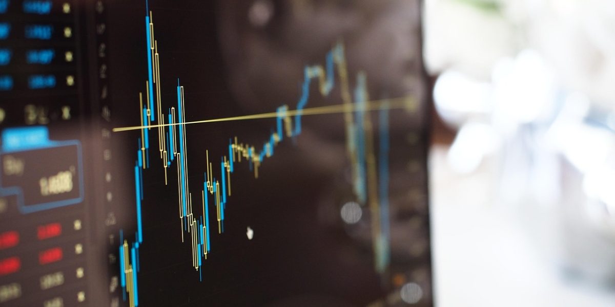 Professionals analyzing market data to identify real estate opportunities.