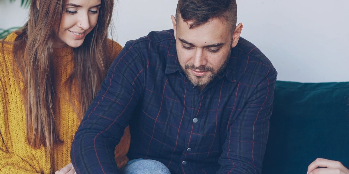 A real estate consultant explaining options to a client during a meeting.