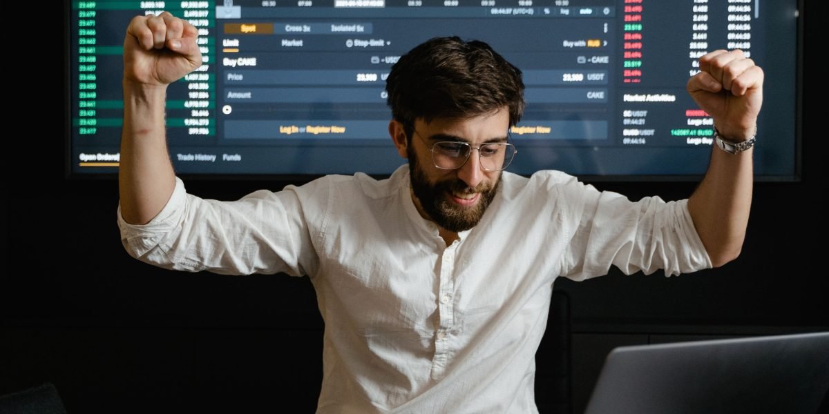 A person celebrating a successful investment outcome, reflecting satisfaction and achievement.