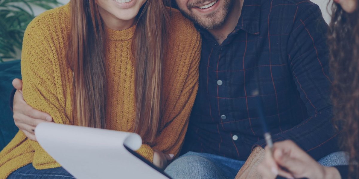 A potential buyer discusses investment options with a real estate advisor, seeking guidance.
