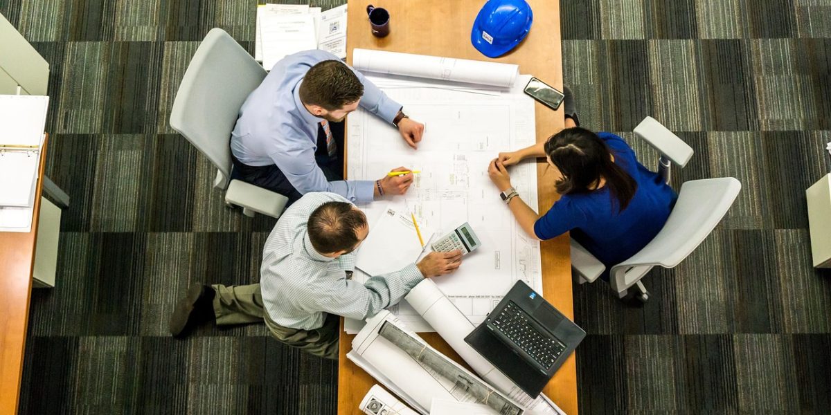 Professionals analyzing market trends and discussing investment growth opportunities.
