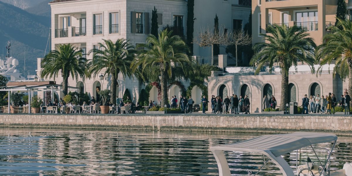 People relaxing in a luxurious waterfront setting, reflecting the exclusive lifestyle offered by Palm Jumeirah properties.