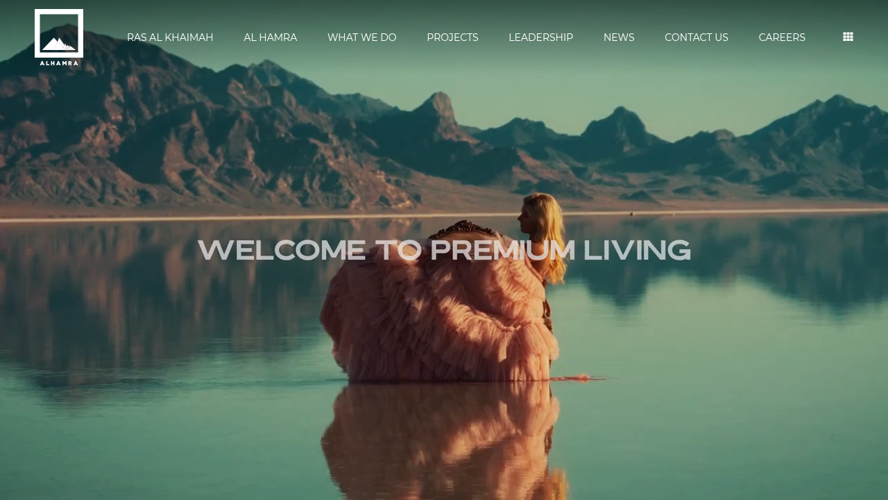 A screenshot of the Al Hamra Group's official website, showcasing their brand and real estate development projects.