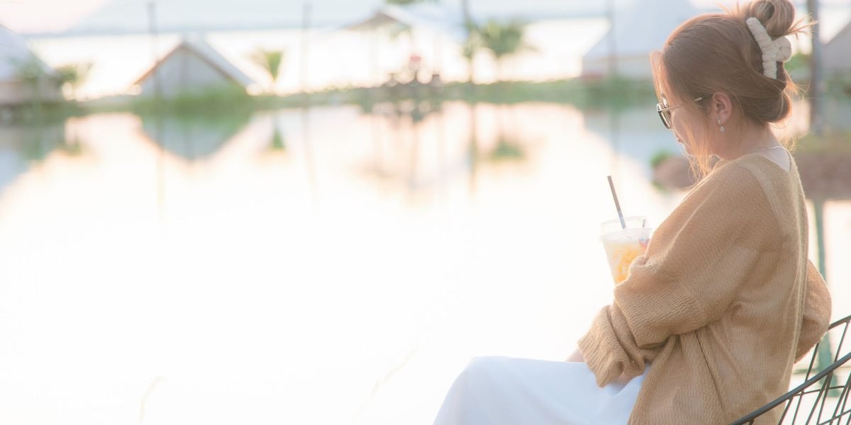 A person enjoying the serene waterfront view from a luxury residence on Palm Jumeirah, highlighting the exclusive lifestyle.